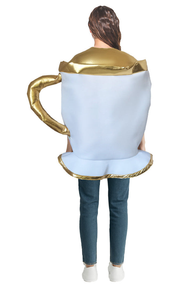 Person wearing a costume shaped like a teacup with gold trim on a white background